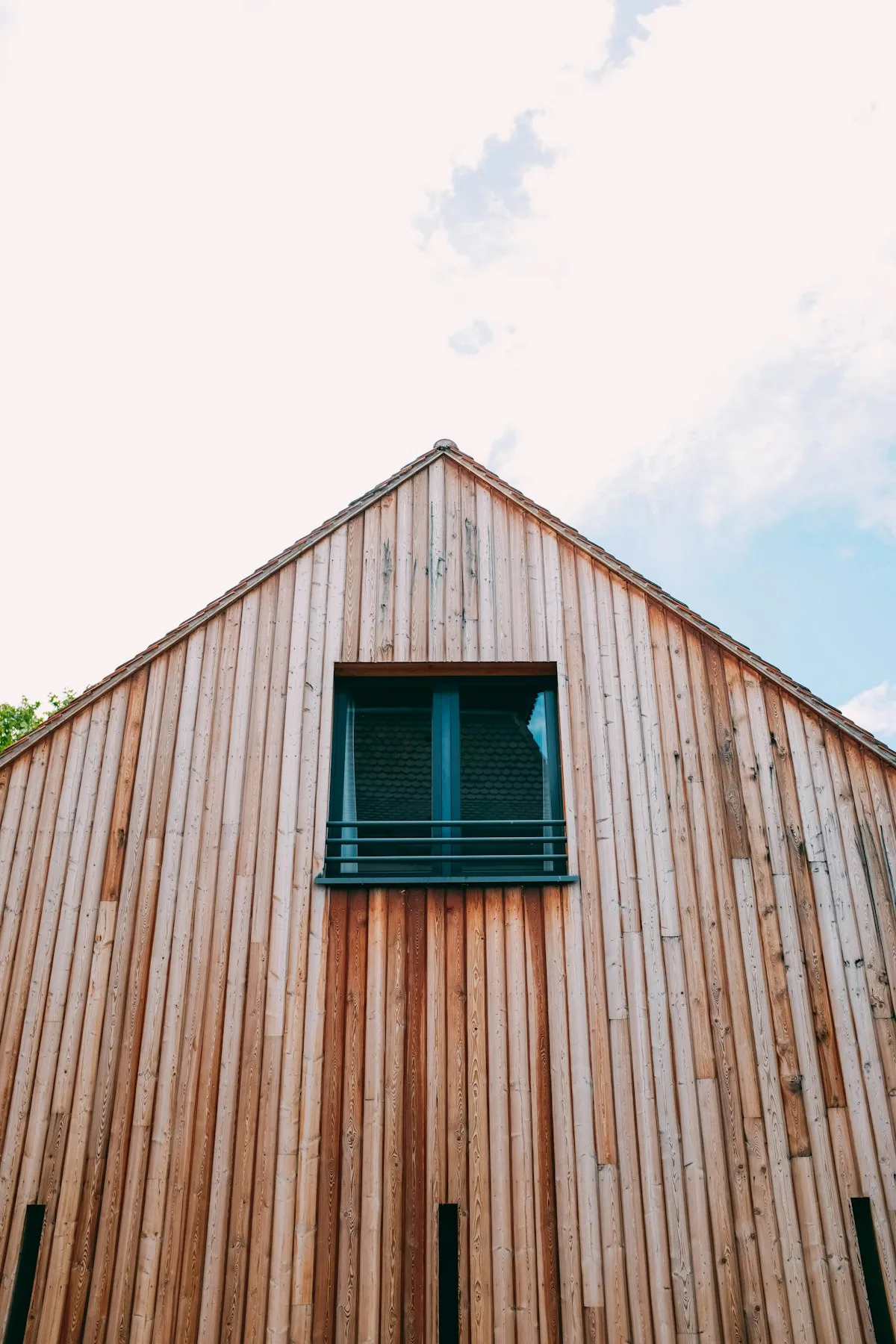 Vertical cedar boards in a light natural stain