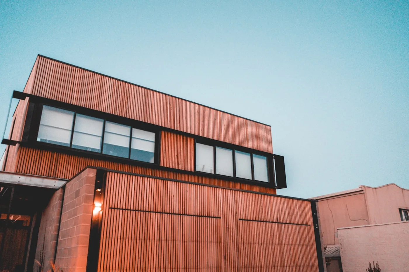 Warm stained cedar cladding on a modern home